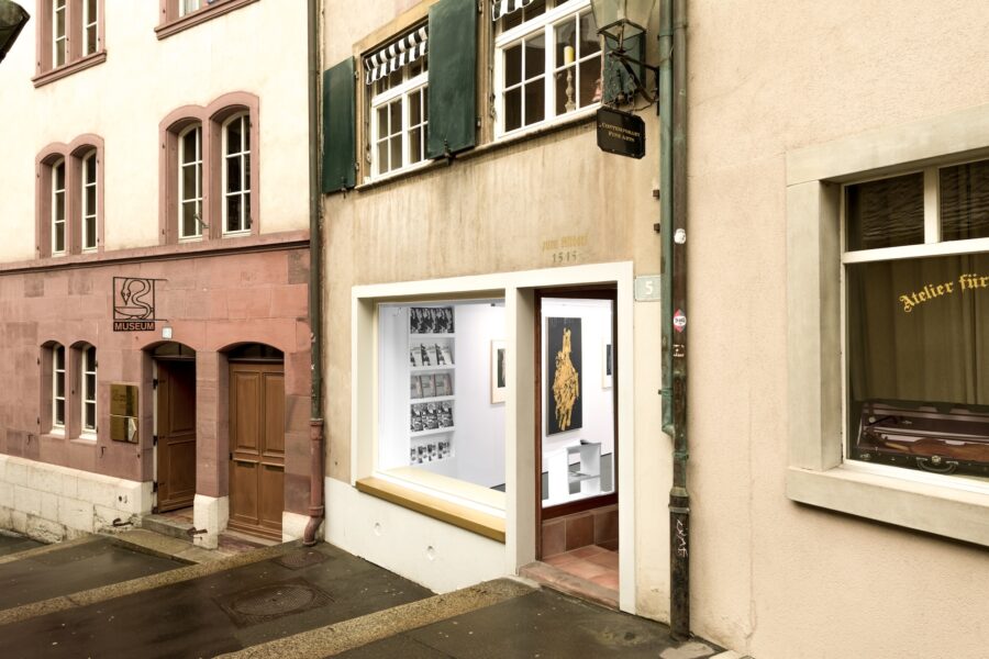 Street view of two historic buildings with a small contemporary art gallery and a museum entrance.